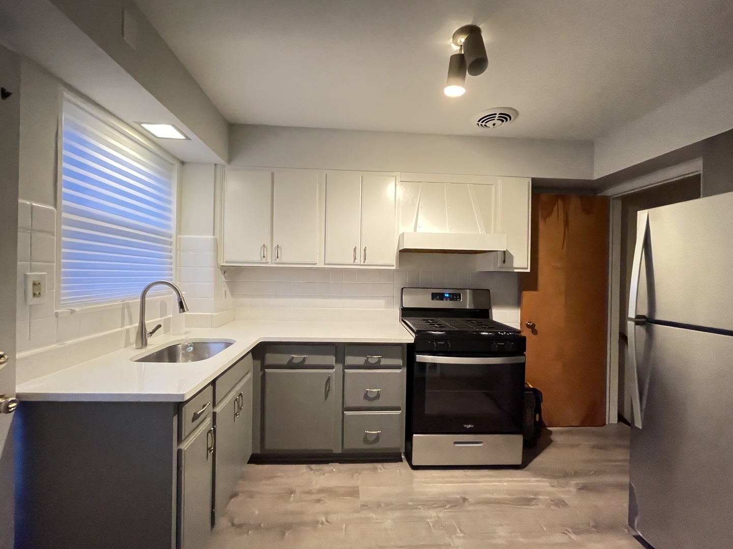 Undisclosed Address Oak Park, IL 60302 - Photo 2 of 15 a kitchen with a sink appliances and cabinets