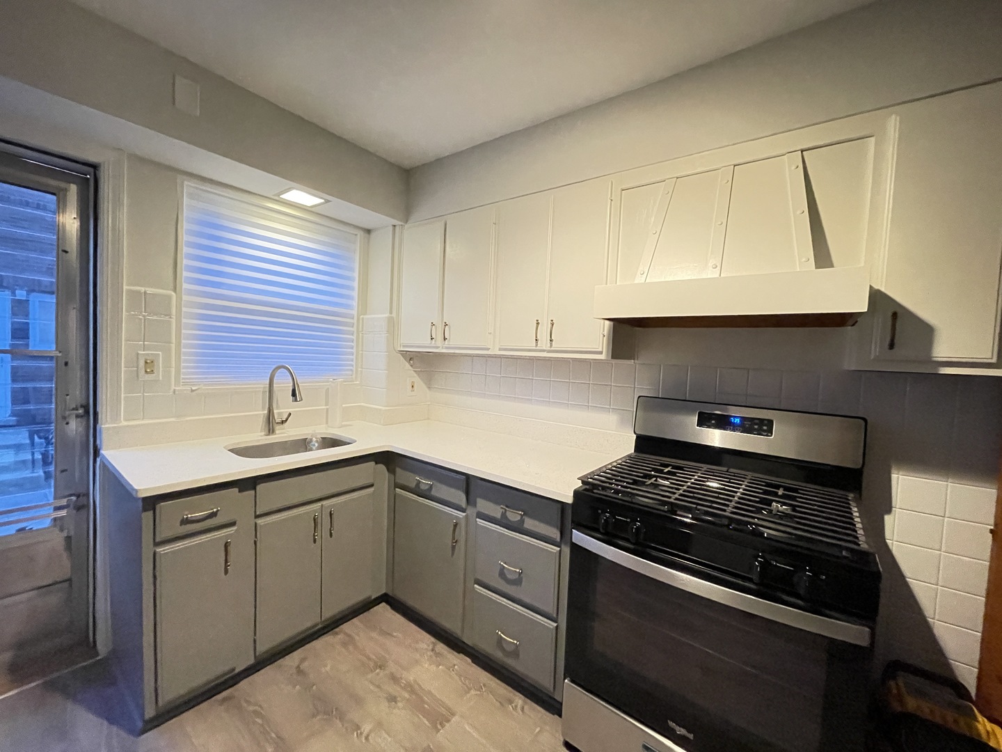 Undisclosed Address Oak Park, IL 60302 - Photo 3 of 15 a kitchen with a sink stove and cabinets