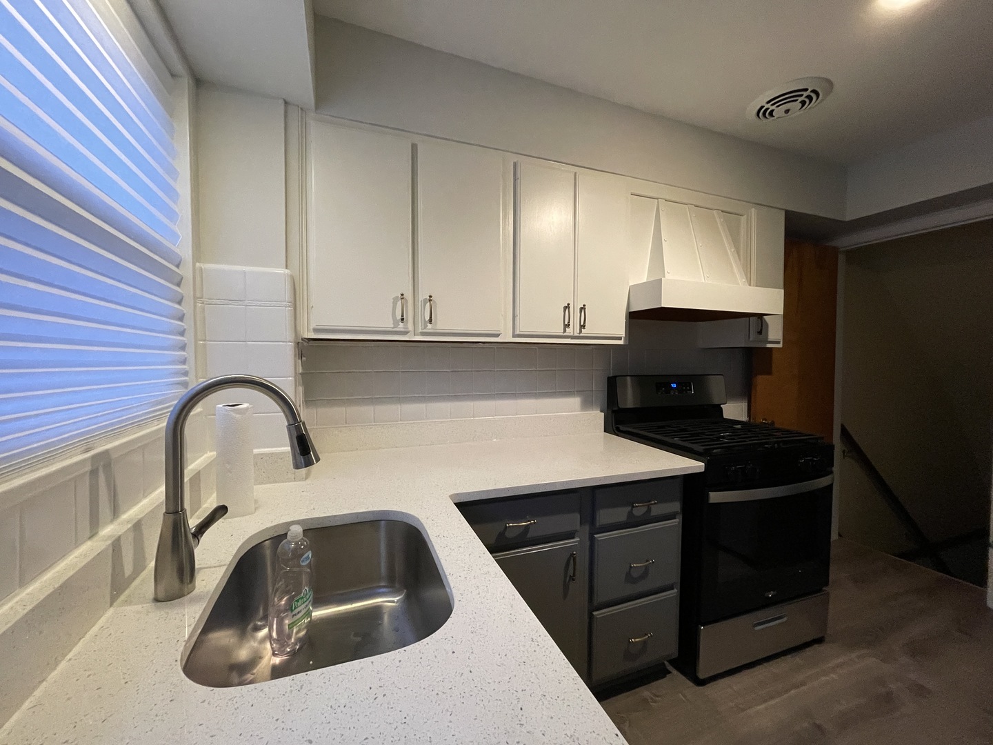 Undisclosed Address Oak Park, IL 60302 - Photo 5 of 15 a kitchen with a sink a stove and cabinets