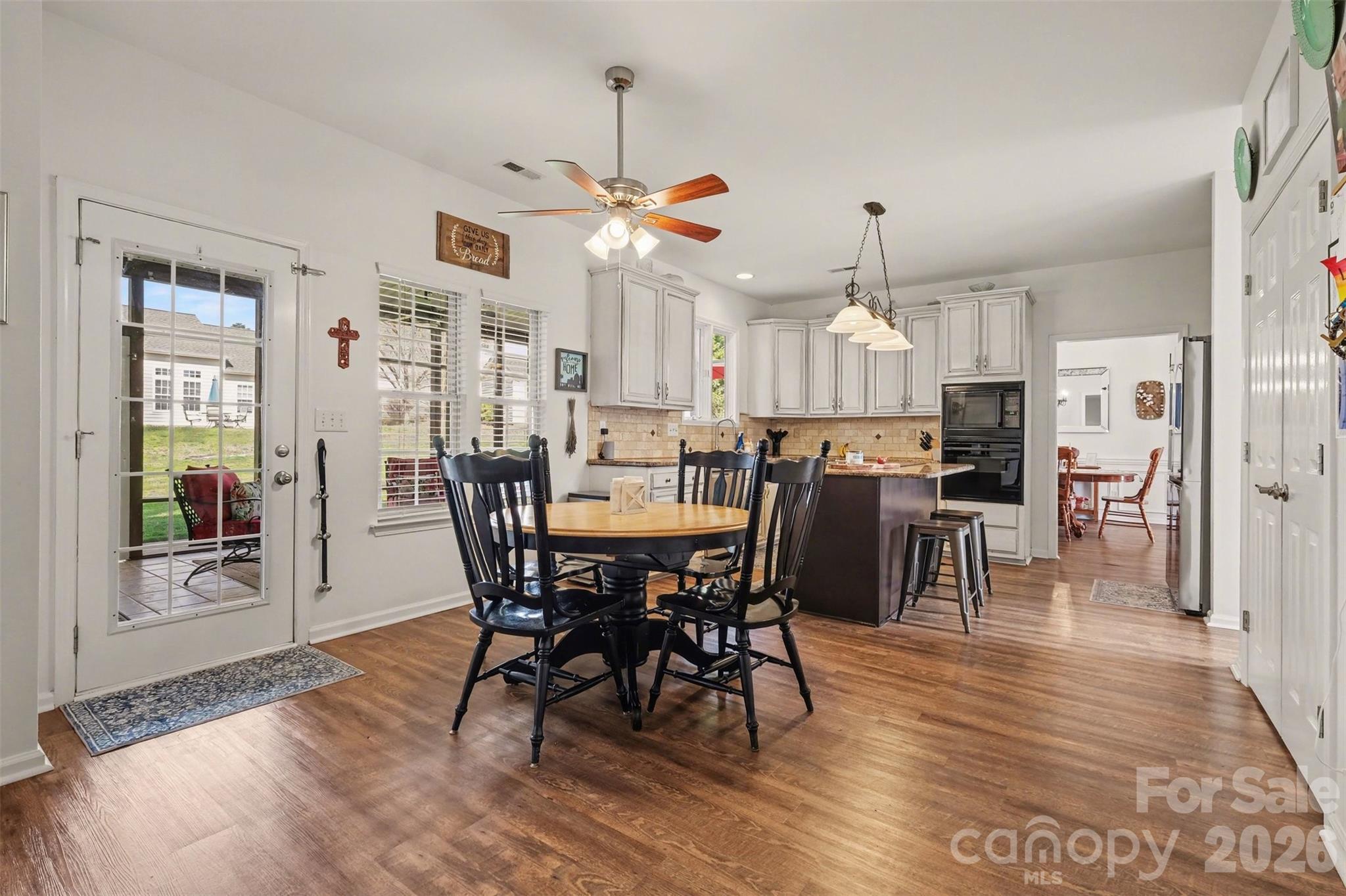 523 Whitehead Court Fort Mill, SC 29708 - Photo 11 of 48 a view of a dining room with furniture window and wooden floor