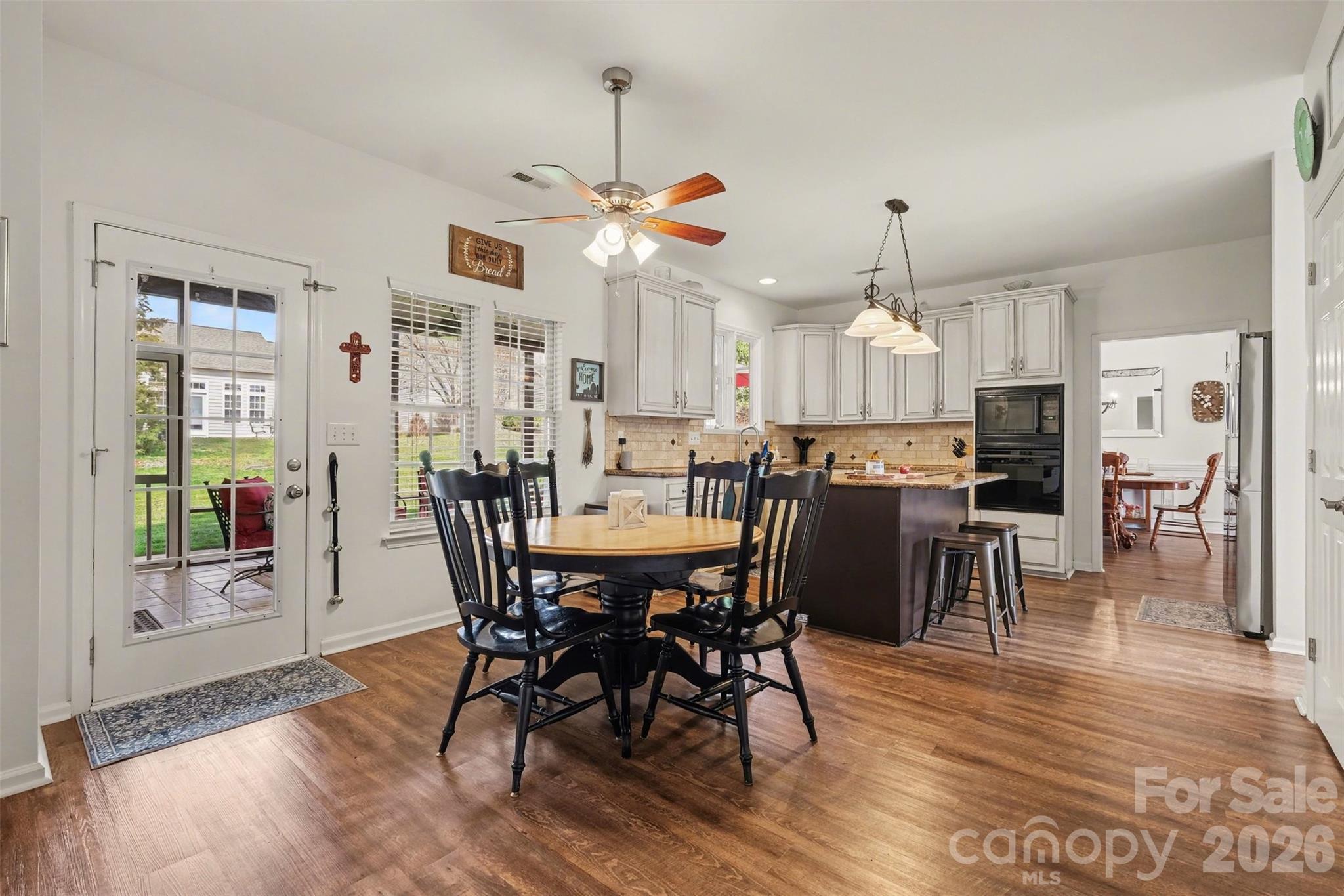523 Whitehead Court Fort Mill, SC 29708 - Photo 12 of 48 a view of a dining room with furniture window and wooden floor