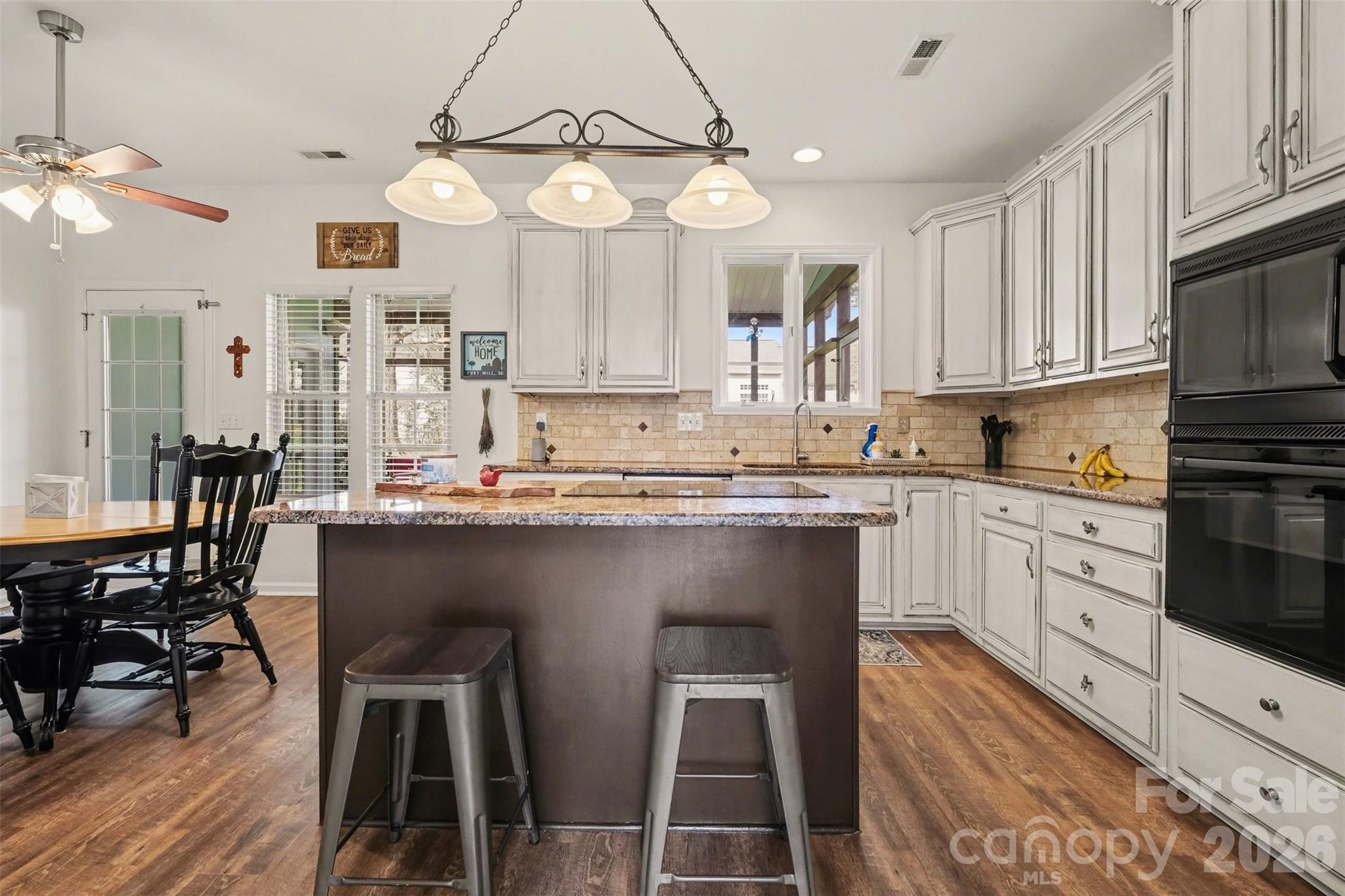 523 Whitehead Court Fort Mill, SC 29708 - Photo 13 of 48 a kitchen with cabinets a sink and appliances