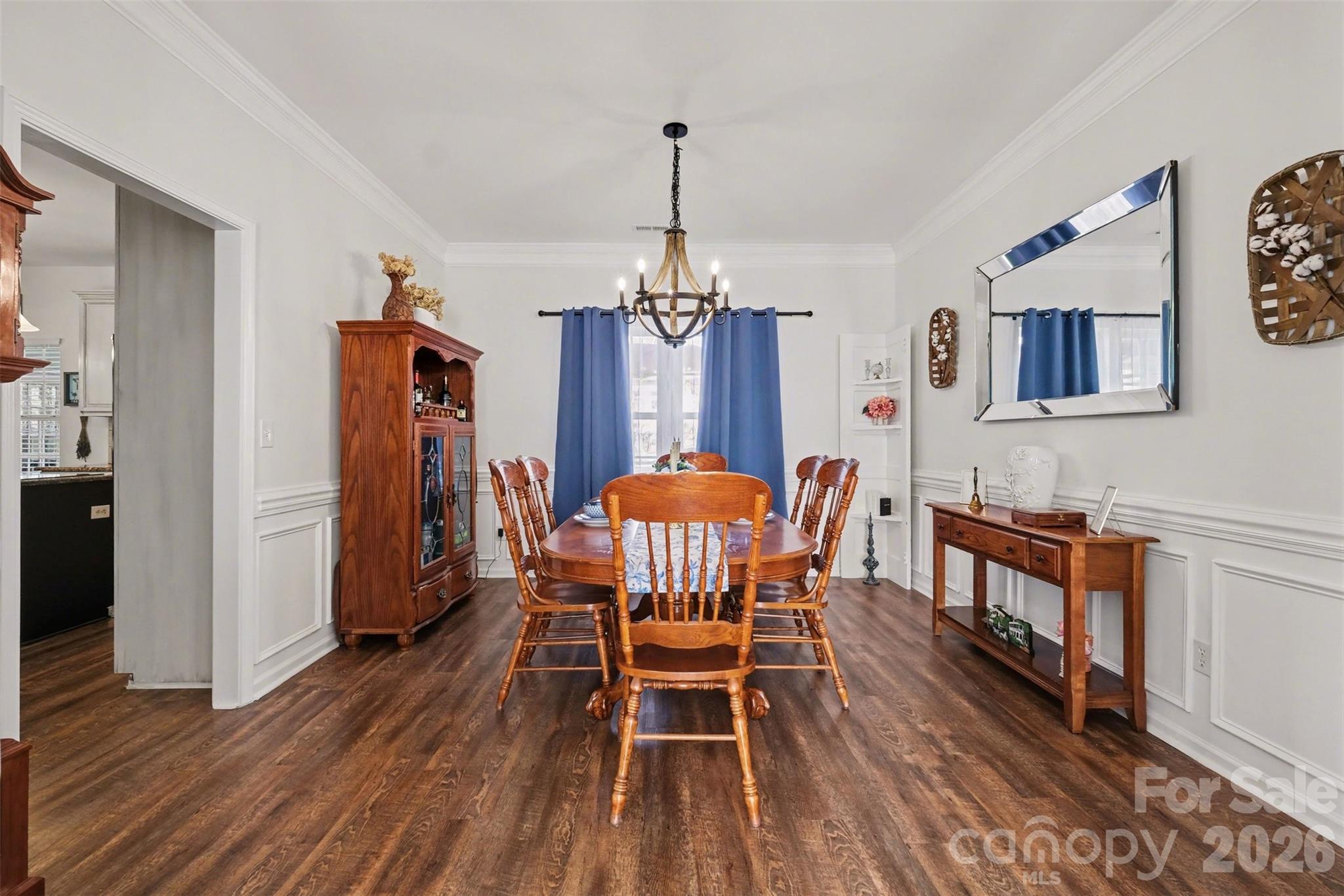 523 Whitehead Court Fort Mill, SC 29708 - Photo 18 of 48 a dining room with furniture a chandelier and wooden floor