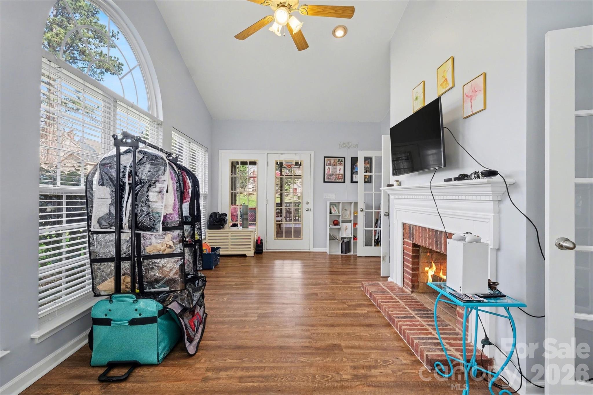 523 Whitehead Court Fort Mill, SC 29708 - Photo 21 of 48 a living room with furniture a flat screen tv and a fireplace