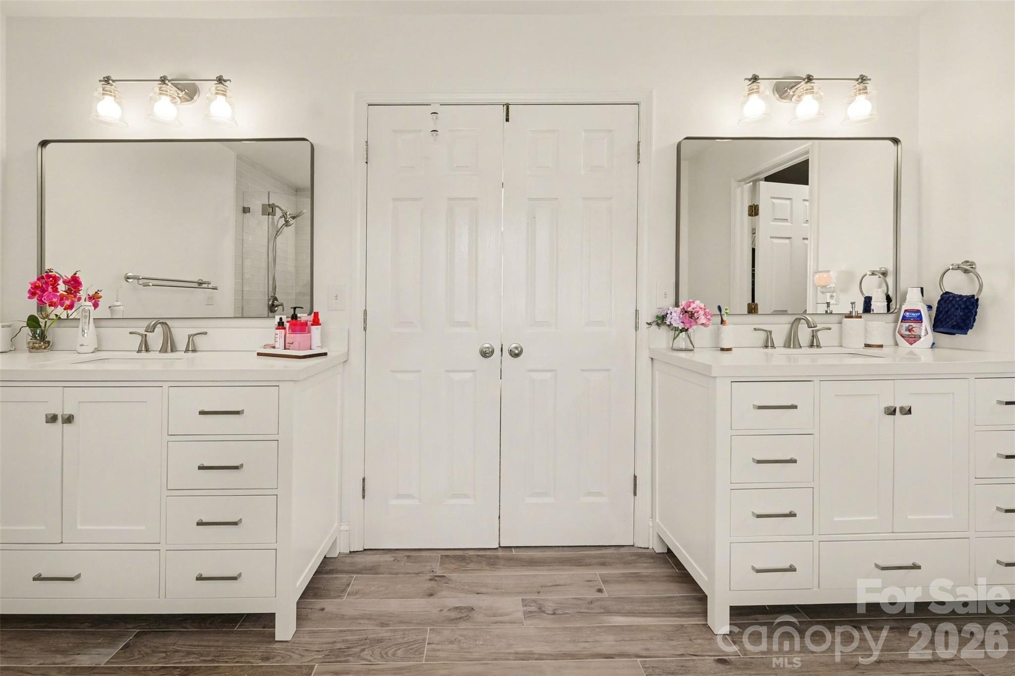 523 Whitehead Court Fort Mill, SC 29708 - Photo 29 of 48 a bathroom with a sink mirror and cabinets