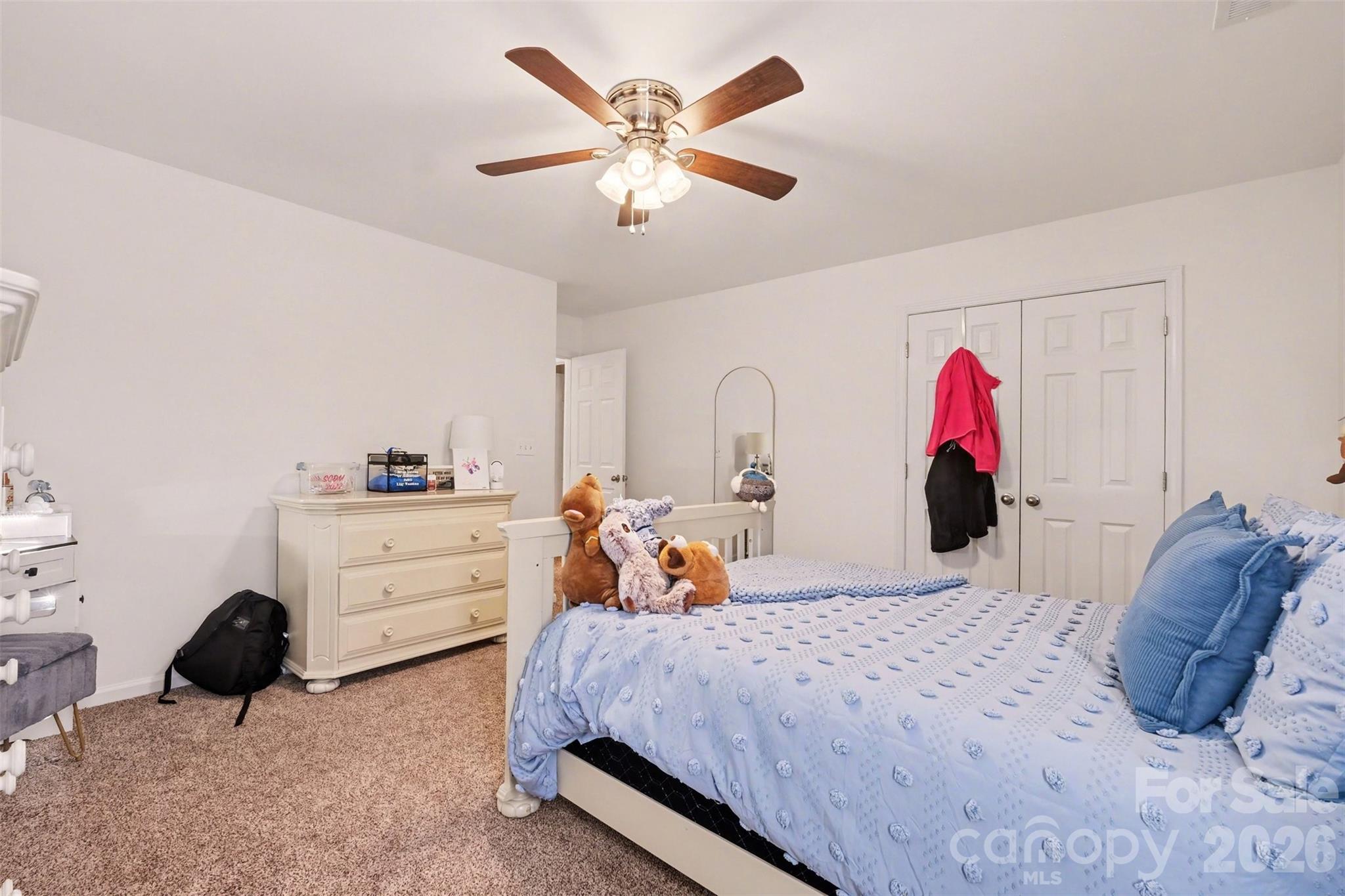 523 Whitehead Court Fort Mill, SC 29708 - Photo 34 of 48 a bed room with a bed and a chair