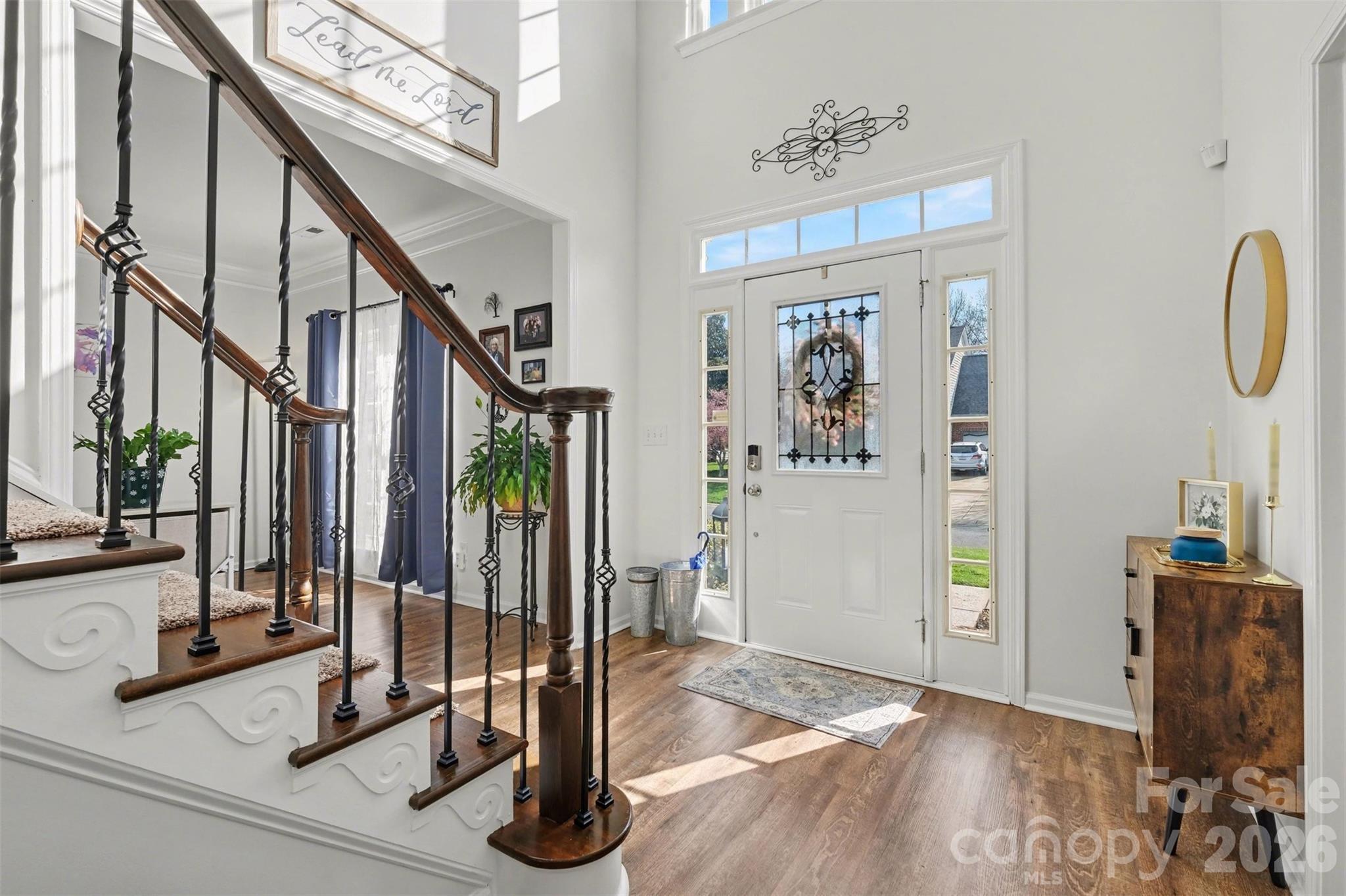 523 Whitehead Court Fort Mill, SC 29708 - Photo 5 of 48 a view of a hallway with wooden floor and windows