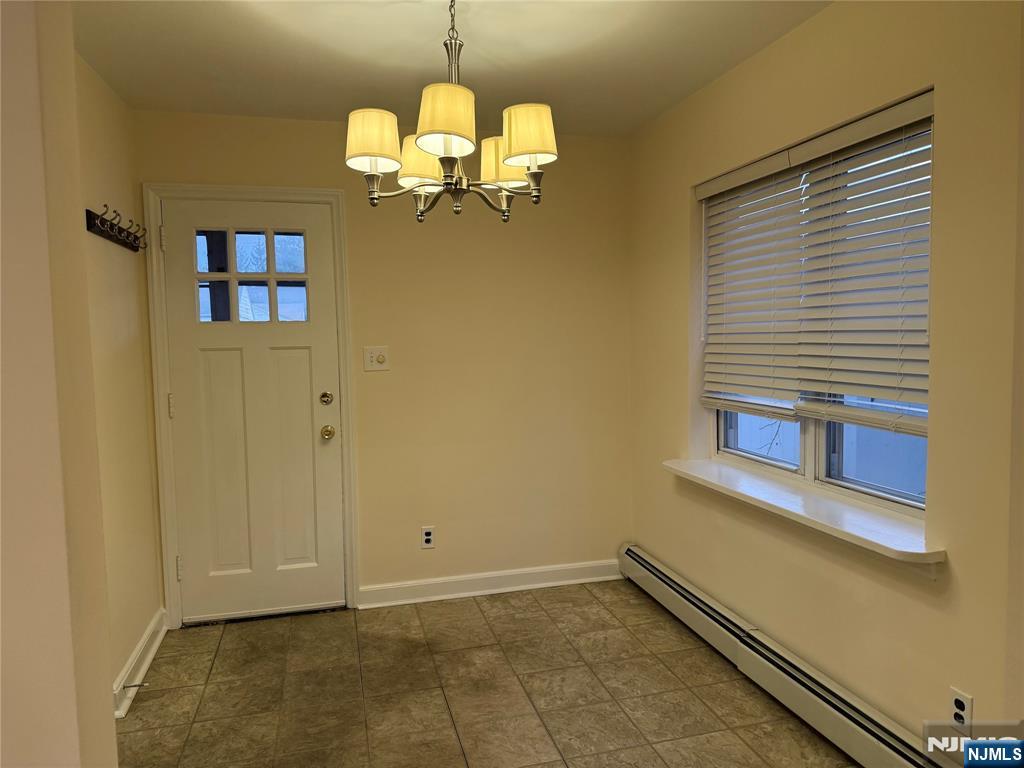 40 Hope Street, Unit 1 East Rutherford, NJ 07073 - Photo 7 of 14 a view of a livingroom with a chandelier