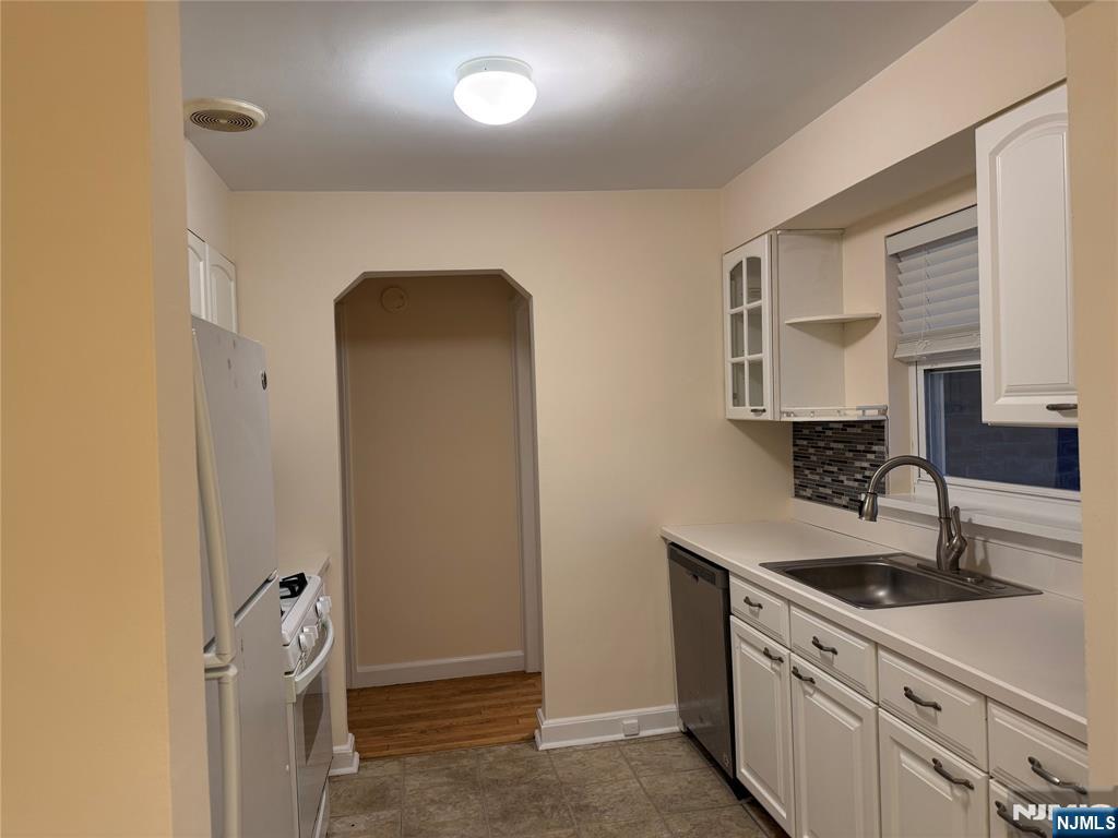 40 Hope Street, Unit 1 East Rutherford, NJ 07073 - Photo 8 of 14 a kitchen with a sink and cabinets