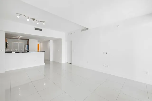 a view of an empty room and window