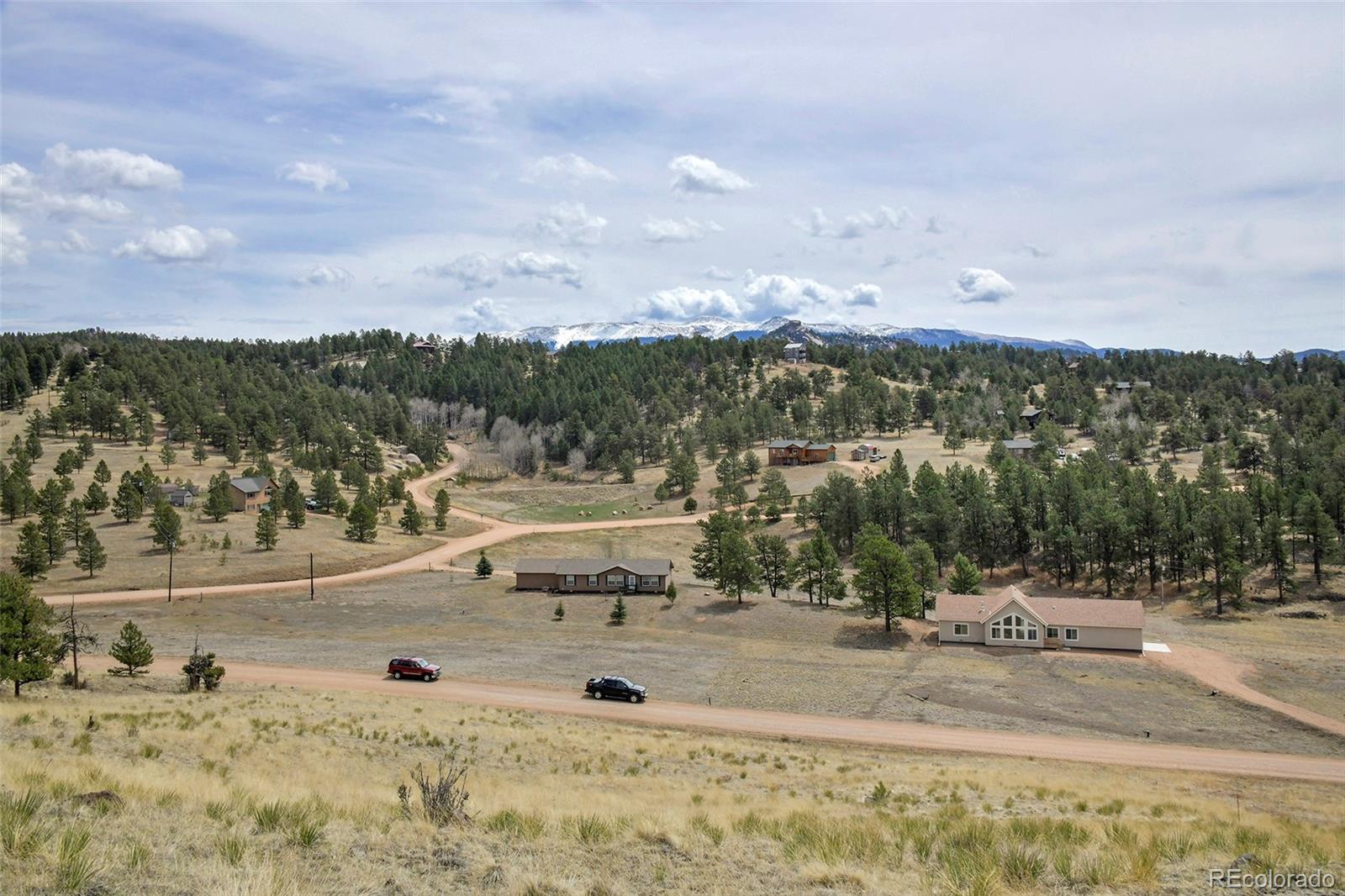 81 High Pasture Road Florissant, CO 80816 - Photo 2 of 26 a view of a town with mountains in the background