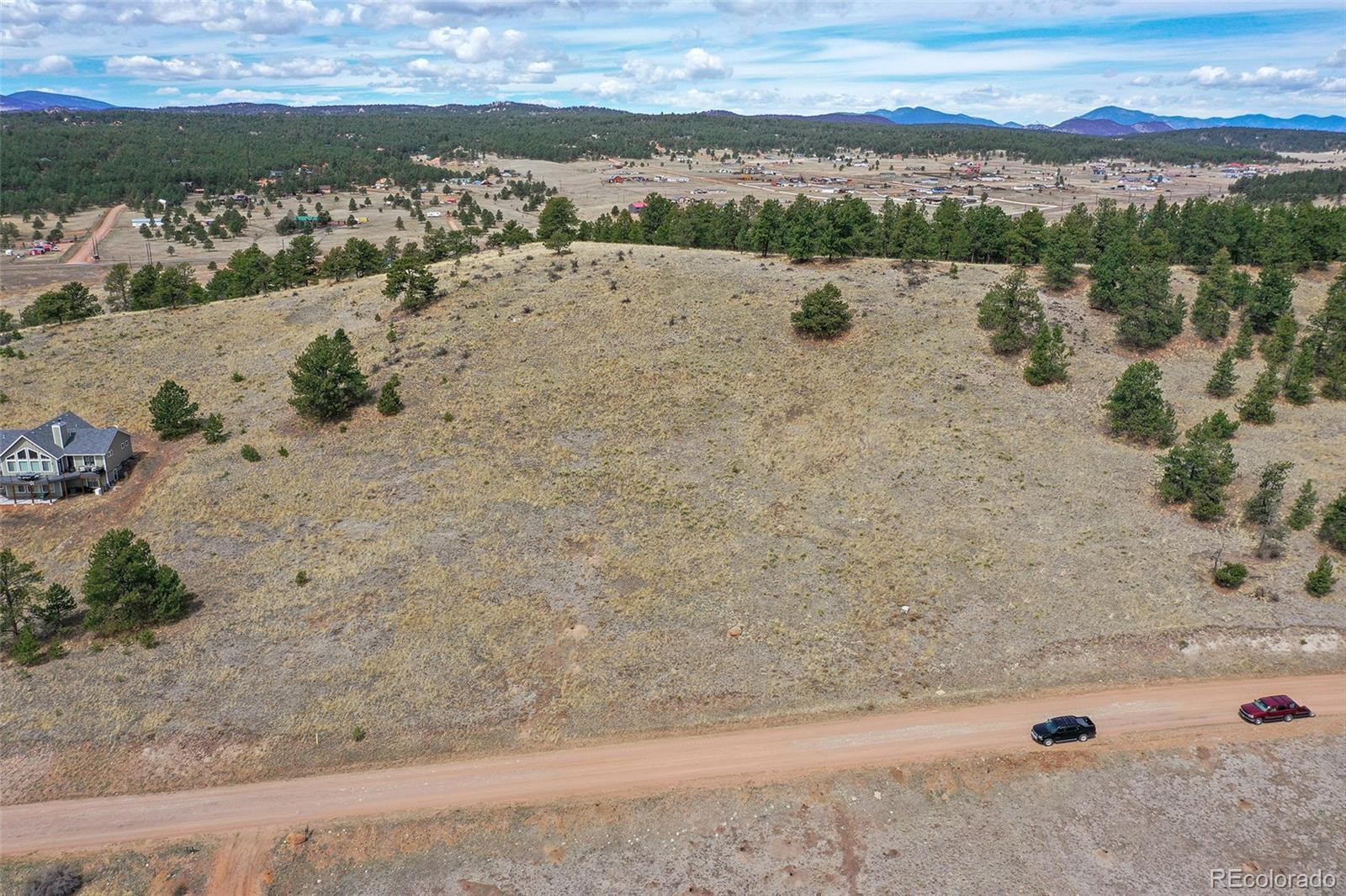81 High Pasture Road Florissant, CO 80816 - Photo 21 of 26 a view of a lake with a mountain