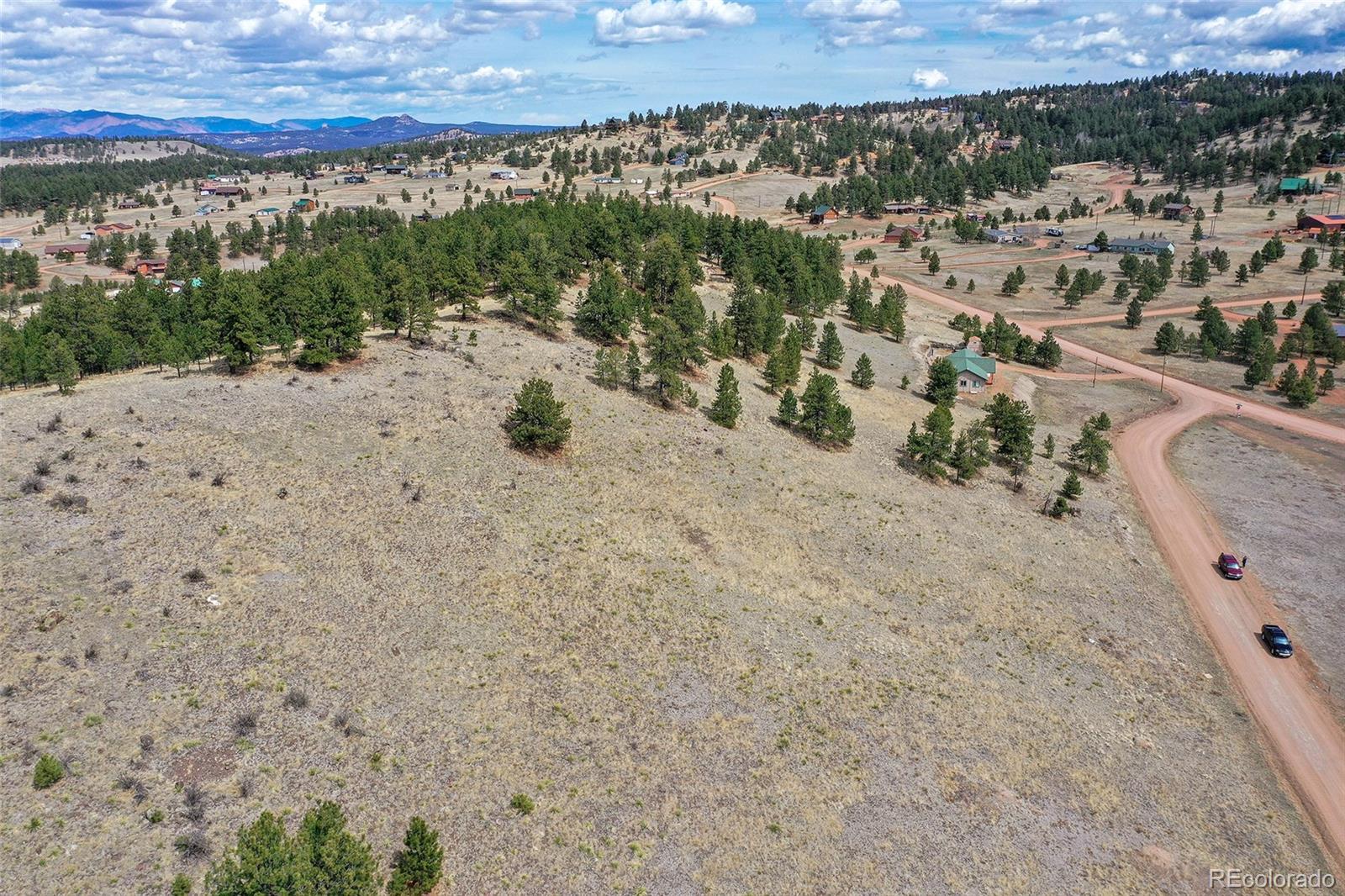 81 High Pasture Road Florissant, CO 80816 - Photo 24 of 26 a view of a dry yard with wooden fence