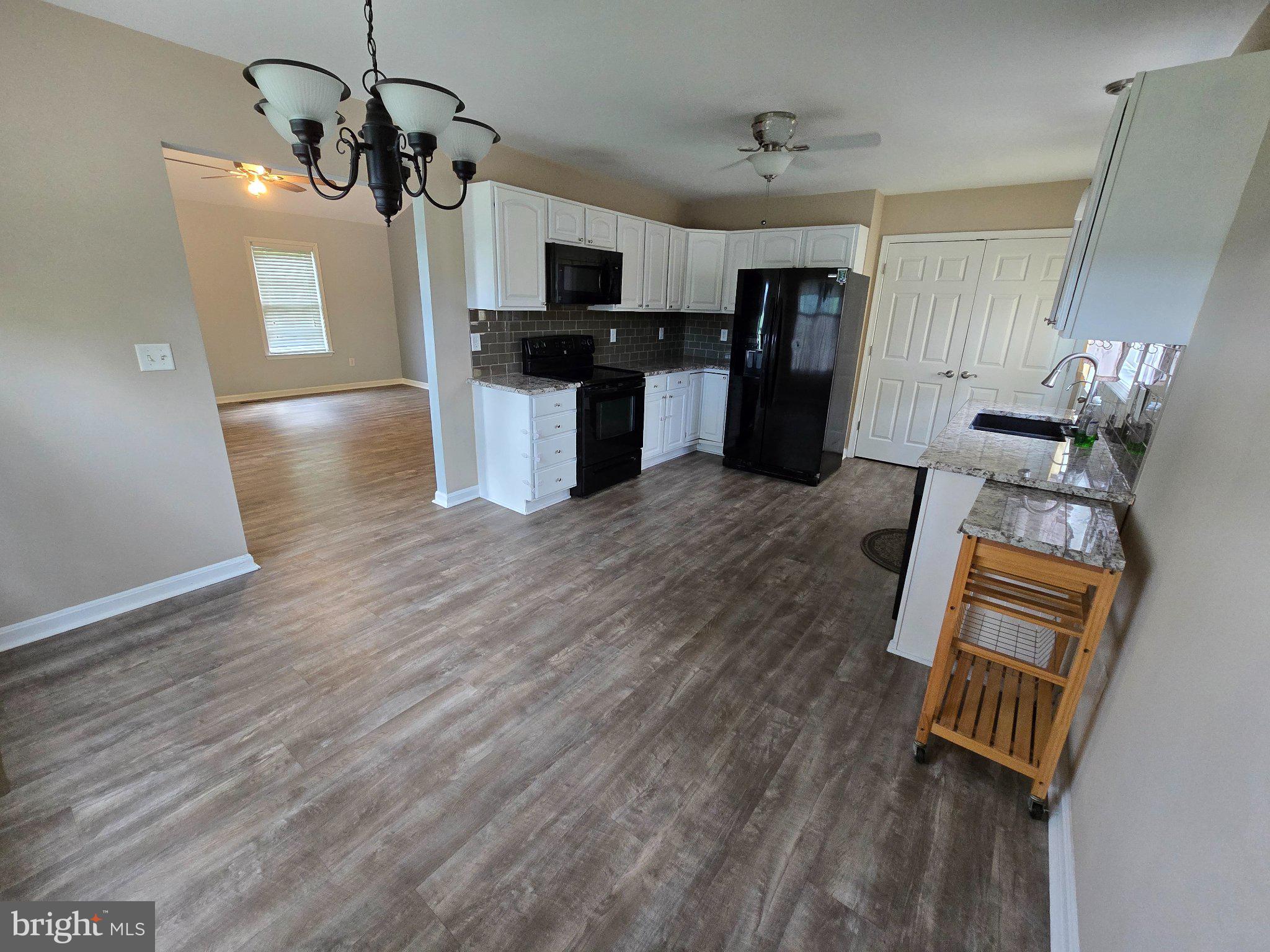 8981 Sharptown Road Laurel, DE 19956 - Photo 11 of 34 Modern kitchen with open layout charm.