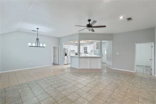a view of a kitchen with microwave and cabinets