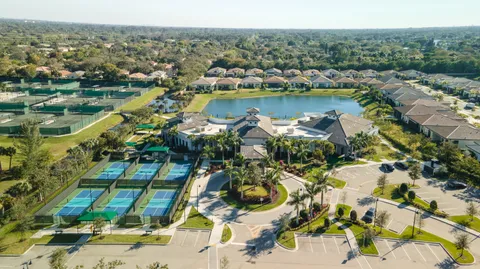 a front view of a house with a yard and a garage