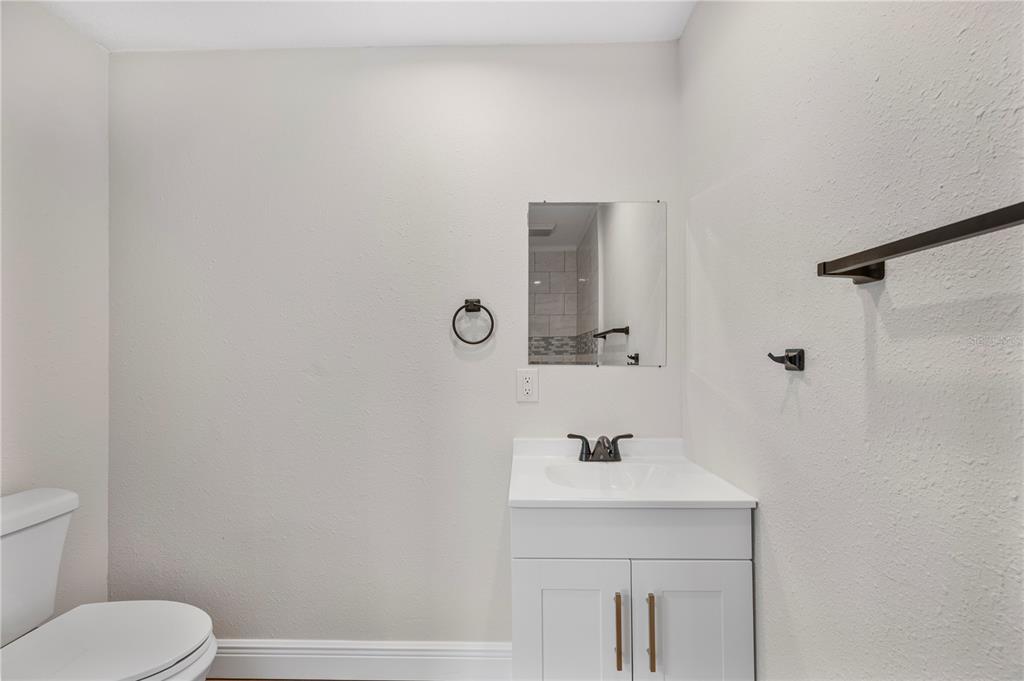 1215 El Camino Road Lakeland, FL 33805 - Photo 11 of 34 a bathroom with a sink toilet and mirror