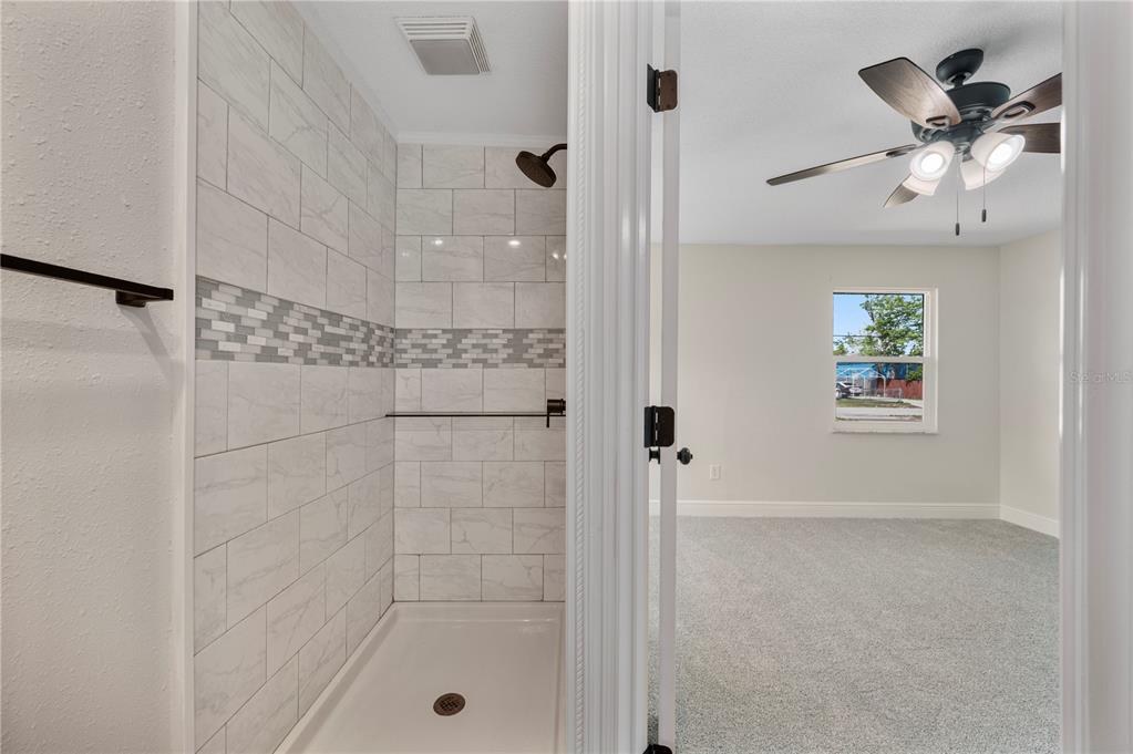 1215 El Camino Road Lakeland, FL 33805 - Photo 12 of 34 a bathroom with a shower