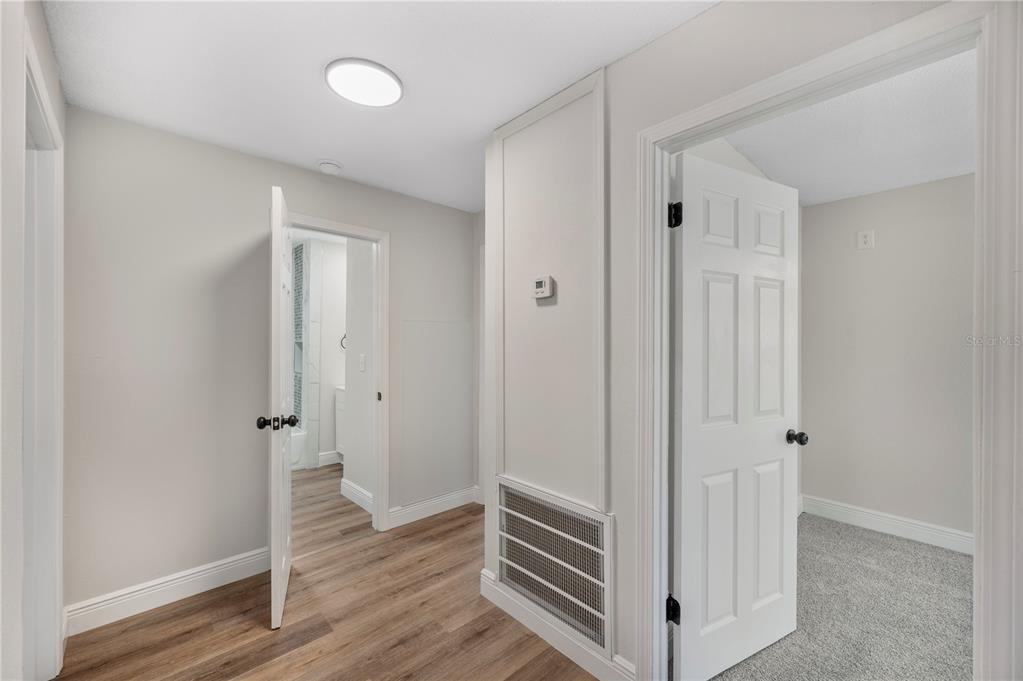 1215 El Camino Road Lakeland, FL 33805 - Photo 14 of 34 a view of a hallway with wooden floor and closet area