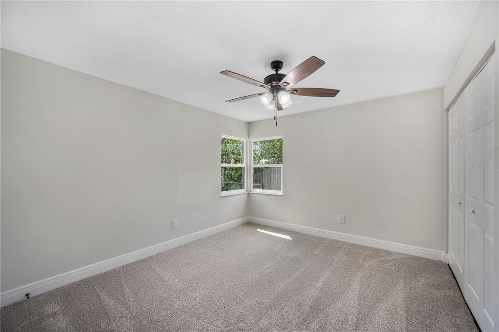 1215 El Camino Road Lakeland, FL 33805 - Photo 15 of 34 an empty room with a window and a fan