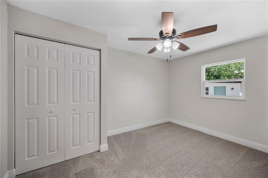 1215 El Camino Road Lakeland, FL 33805 - Photo 18 of 34 an empty room with windows and fan