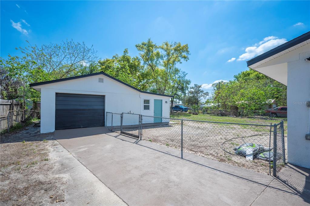 1215 El Camino Road Lakeland, FL 33805 - Photo 21 of 34 a house with trees in the background