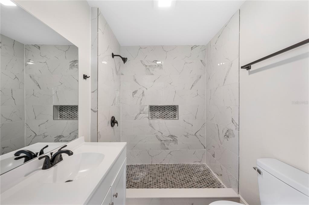 1215 El Camino Road Lakeland, FL 33805 - Photo 25 of 34 a bathroom with a bathtub sink and toilet