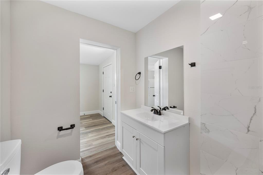 1215 El Camino Road Lakeland, FL 33805 - Photo 26 of 34 a bathroom with a double vanity sink mirror and toilet