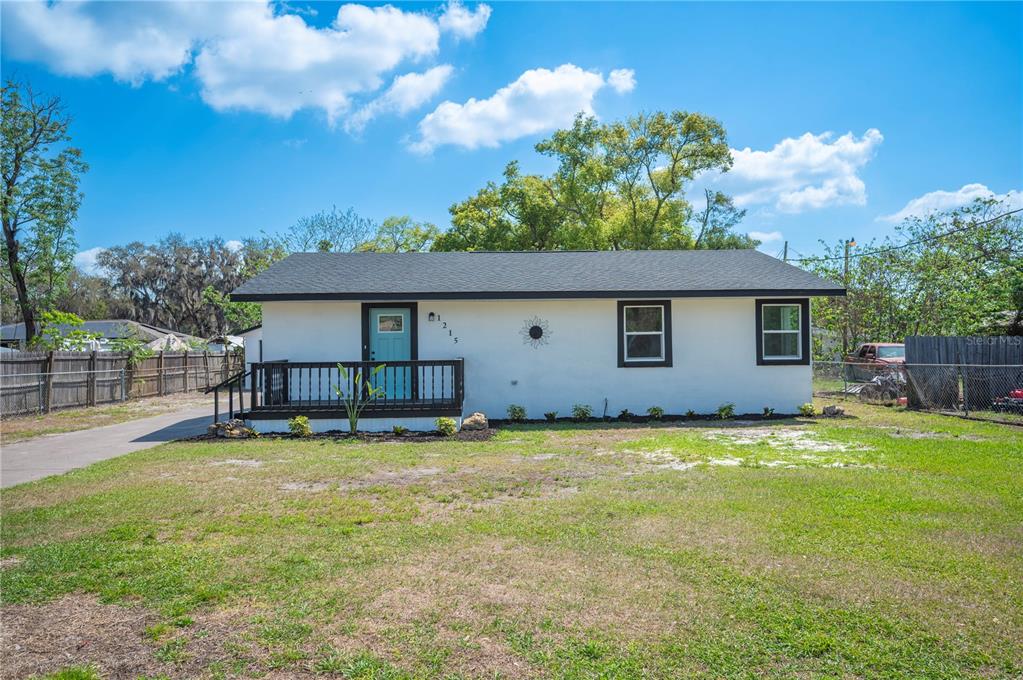 1215 El Camino Road Lakeland, FL 33805 - Photo 32 of 34 a view of a house with a yard and a large tree
