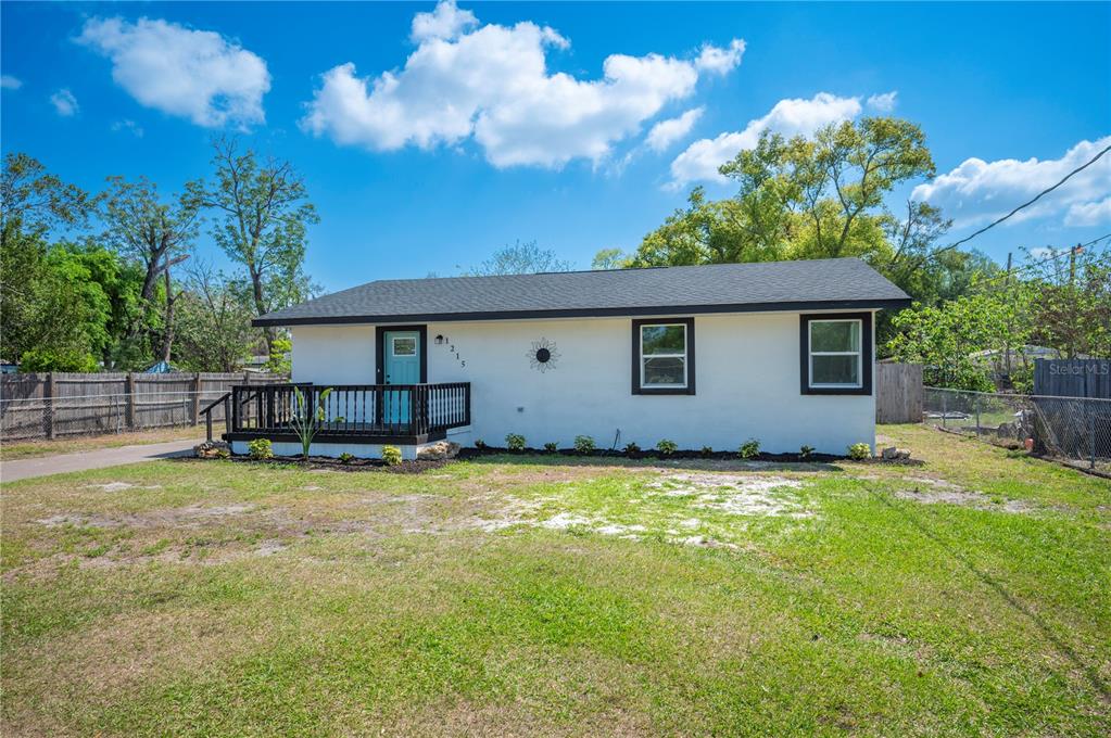 1215 El Camino Road Lakeland, FL 33805 - Photo 33 of 34 a view of a house with swimming pool and a yard