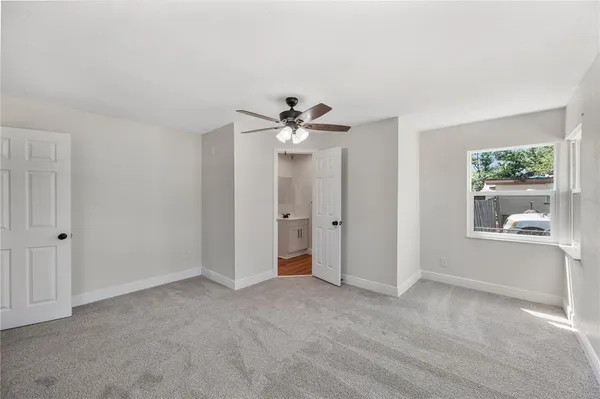 a view of an empty room with a window