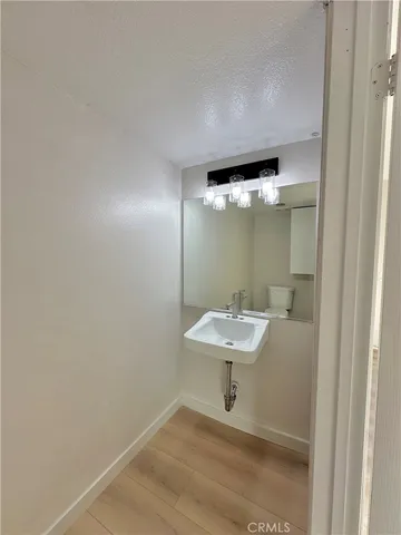 a bathroom with a sink and mirror