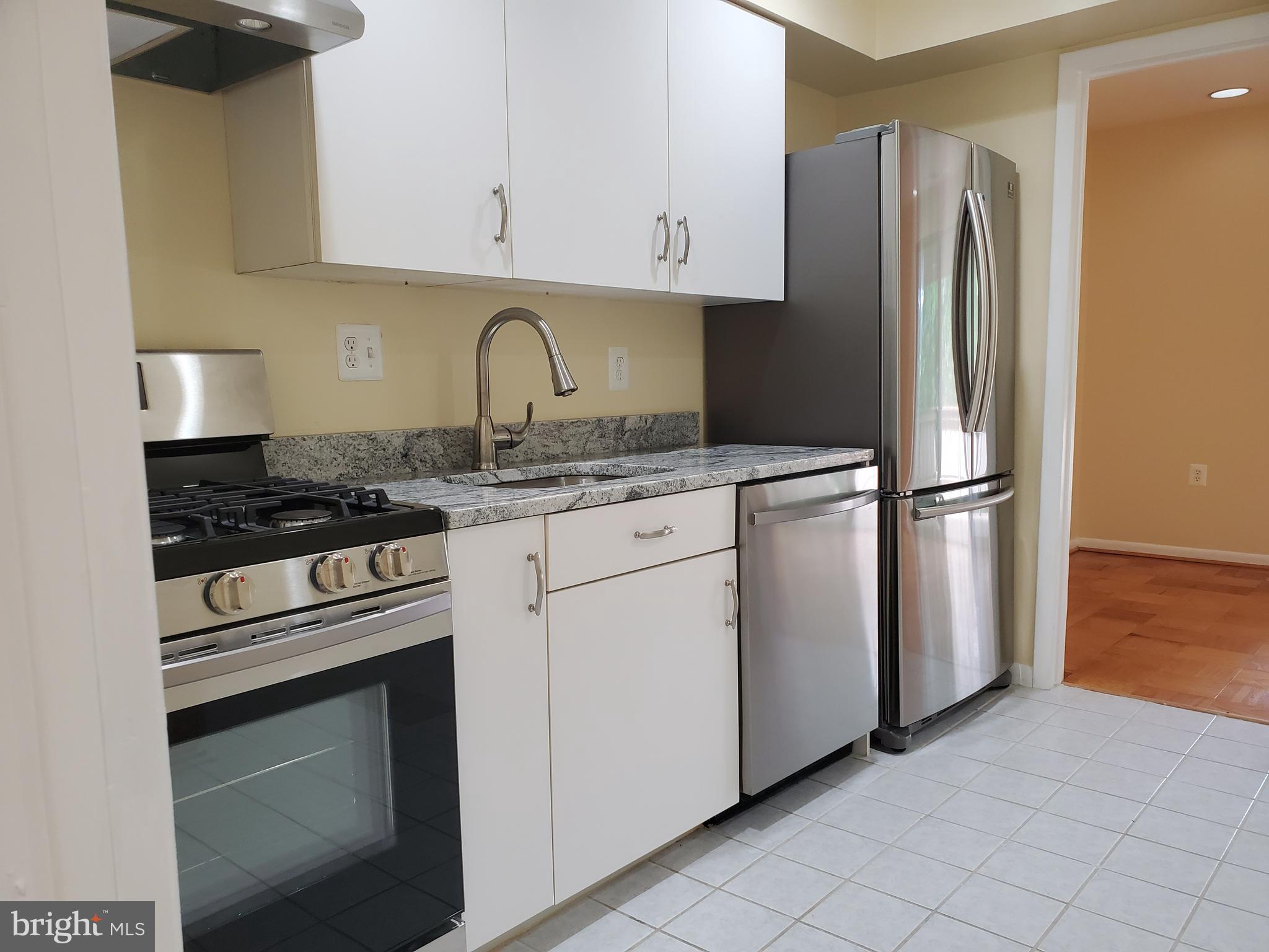 117 Cross Keys Road, Unit R117F Baltimore, MD 21210 - Photo 12 of 34 Renovated Kitchen with Granite Counter Tops
