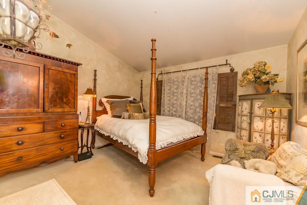 57 Fieldstone Road Bedminster, NJ 07921 - Photo 11 of 22 a bedroom with a bed and large window