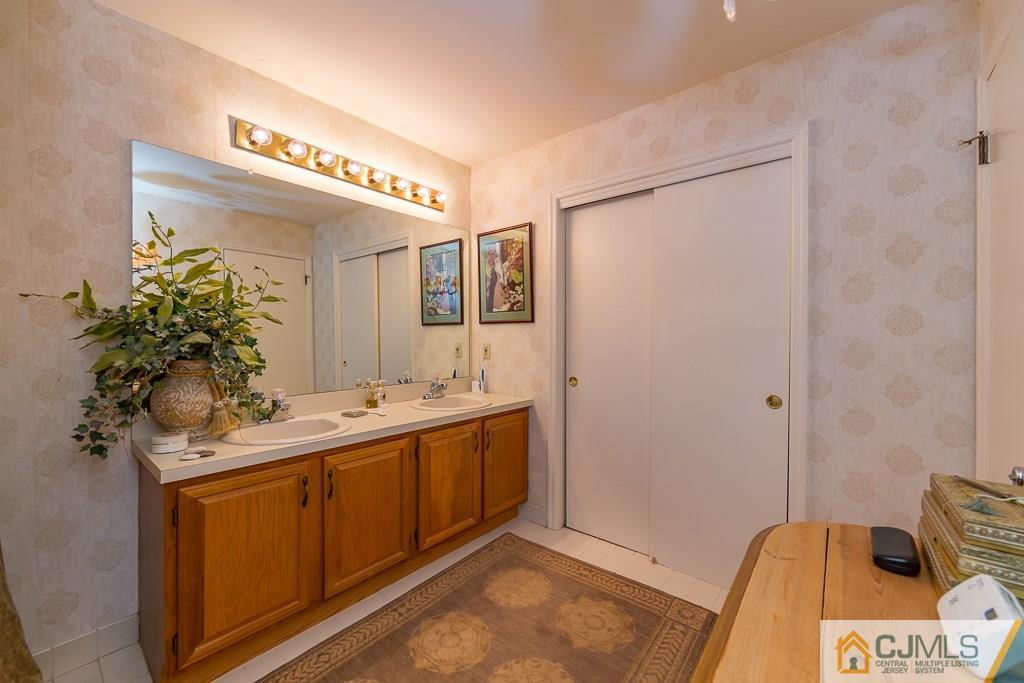 57 Fieldstone Road Bedminster, NJ 07921 - Photo 14 of 22 a bathroom with a sink and mirror