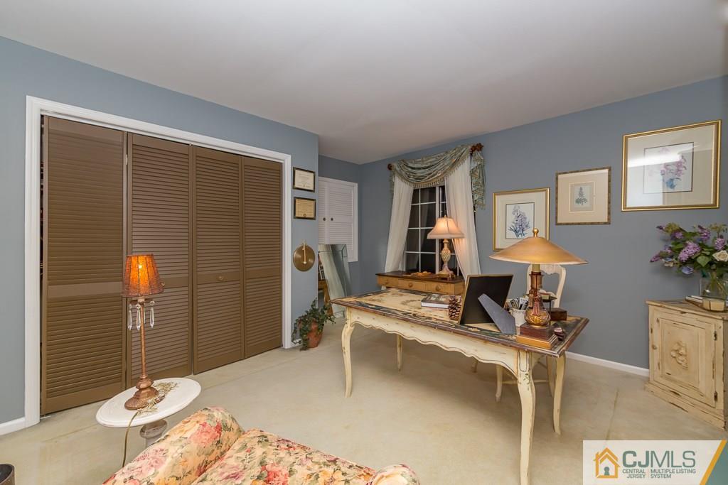 57 Fieldstone Road Bedminster, NJ 07921 - Photo 15 of 22 a living room with furniture and a table