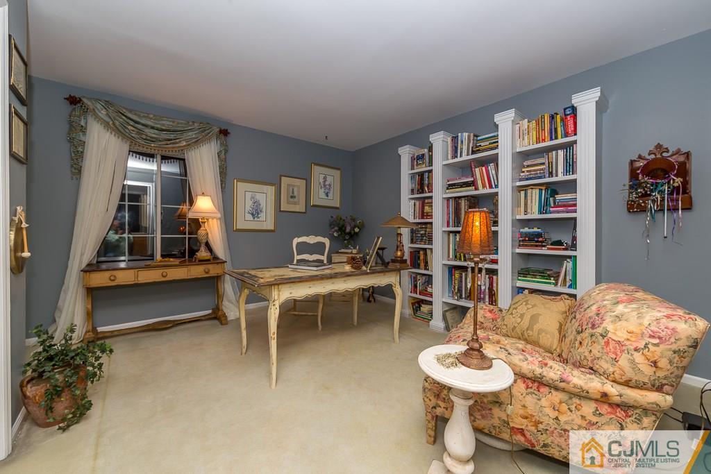 57 Fieldstone Road Bedminster, NJ 07921 - Photo 16 of 22 a living room with furniture and a book shelf