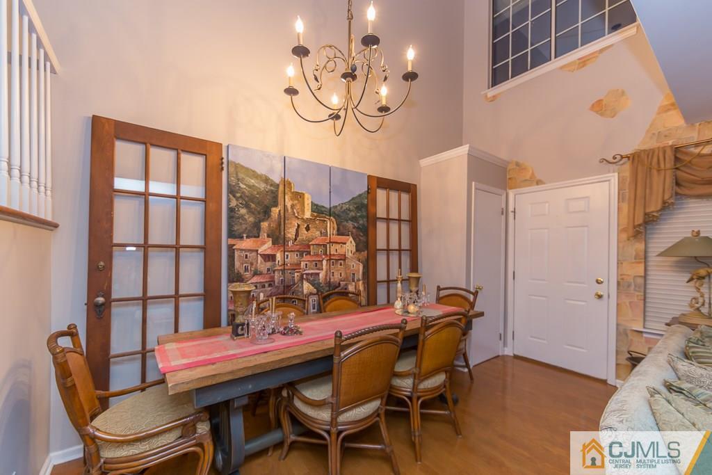 57 Fieldstone Road Bedminster, NJ 07921 - Photo 3 of 22 a dining room with furniture and wooden floor