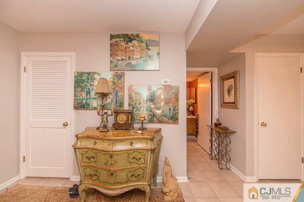 57 Fieldstone Road Bedminster, NJ 07921 - Photo 7 of 22 a room with painting on wall and a table