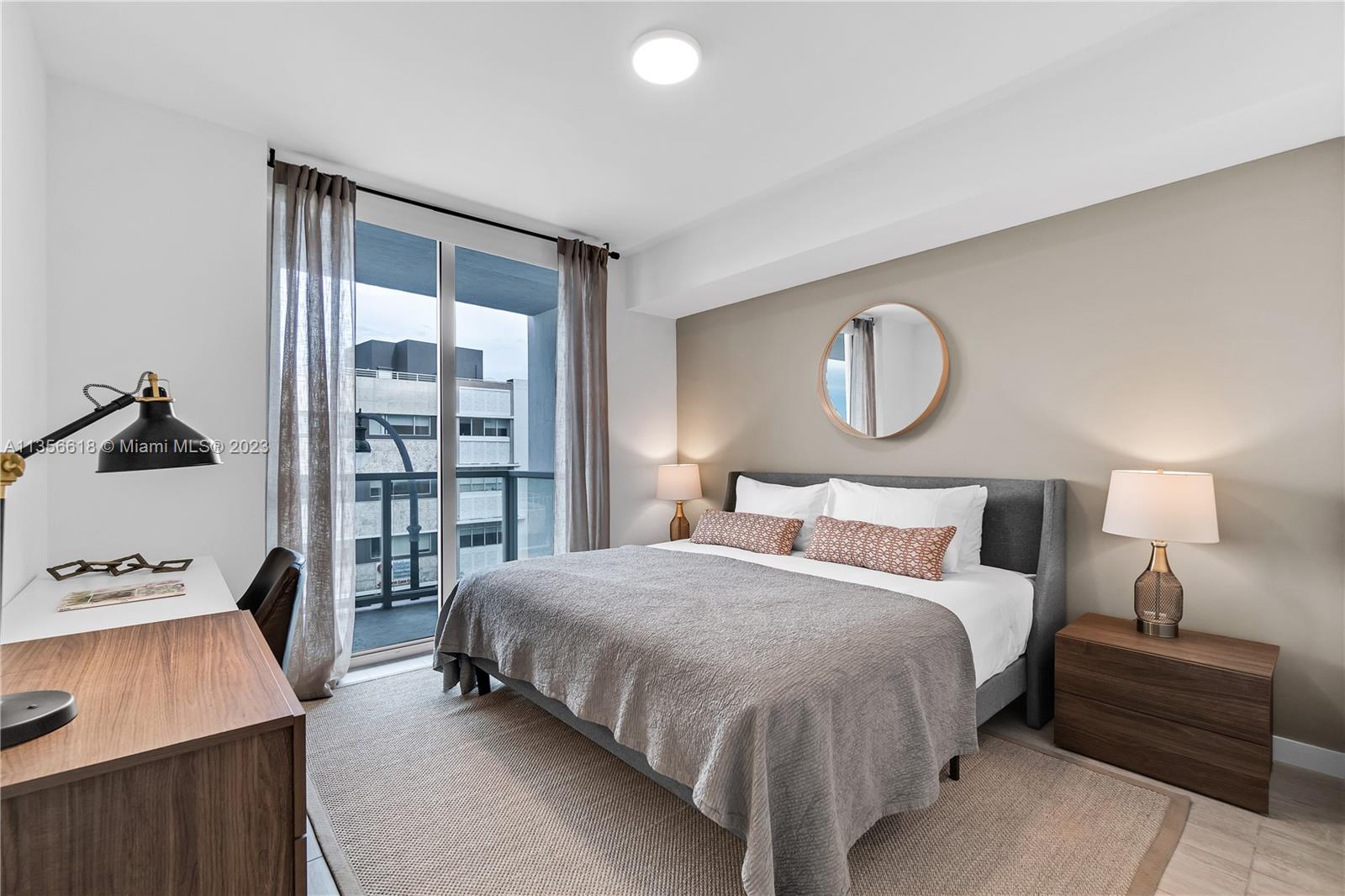 3900 Biscayne Boulevard, Unit S320 Miami, FL 33137 - Photo 21 of 42 a bedroom with a bed and window