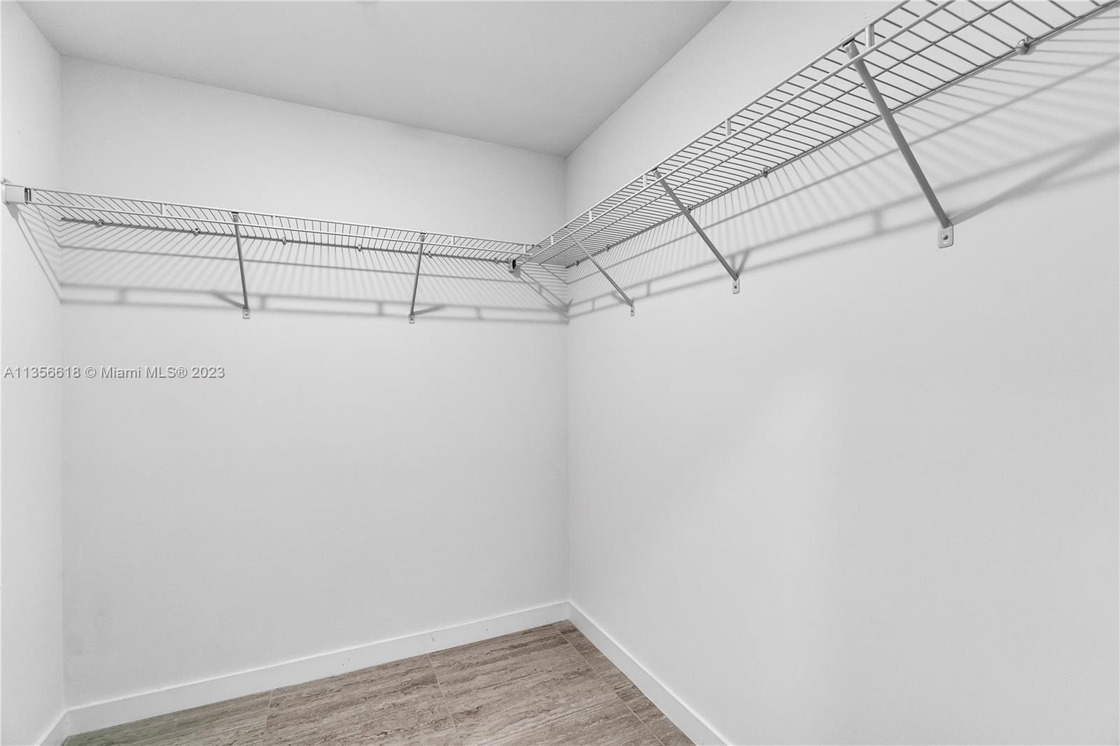 3900 Biscayne Boulevard, Unit S320 Miami, FL 33137 - Photo 24 of 42 a view of a room with racks on the wall