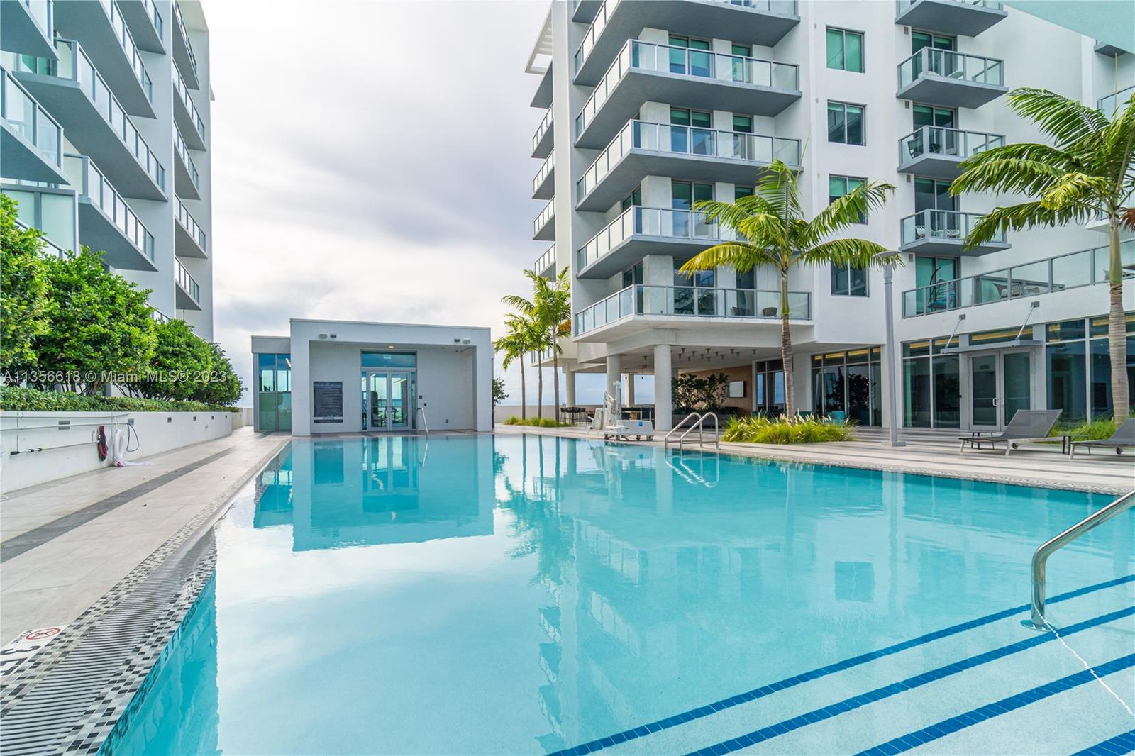 3900 Biscayne Boulevard, Unit S320 Miami, FL 33137 - Photo 3 of 42 a view of a building with a swimming pool
