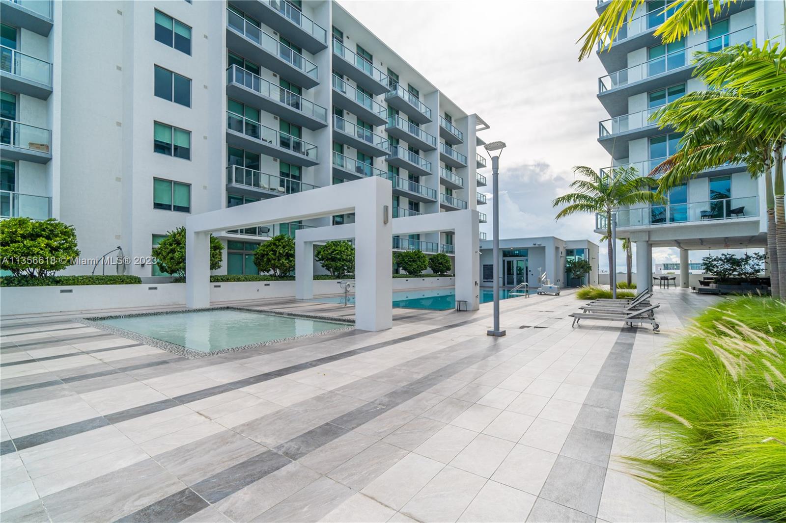 3900 Biscayne Boulevard, Unit S320 Miami, FL 33137 - Photo 39 of 42 a view of building with yard