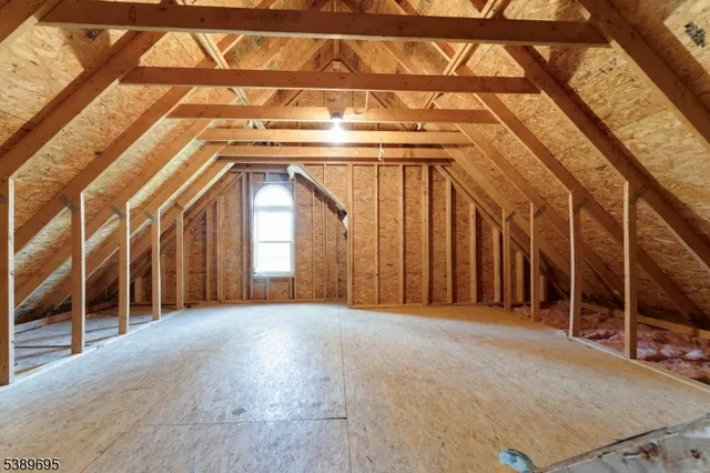 a view of a room with wooden walls
