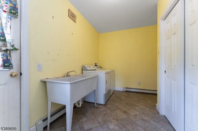 a view of a city with lush green forest