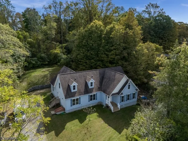 an aerial view of a house with a big yard