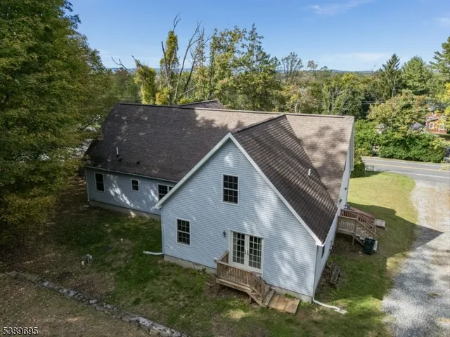 a aerial view of a house with a yard