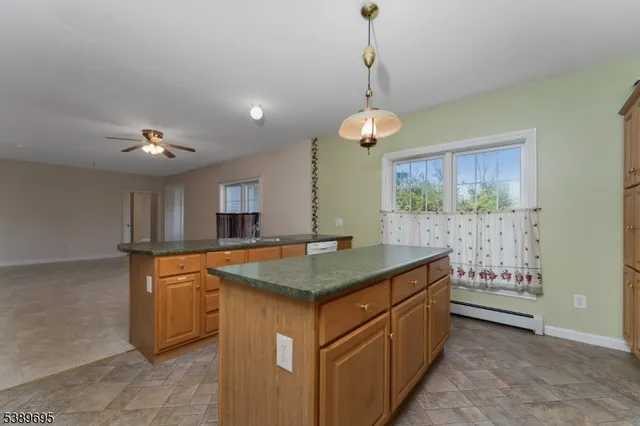 a kitchen that has a lot of cabinets in it