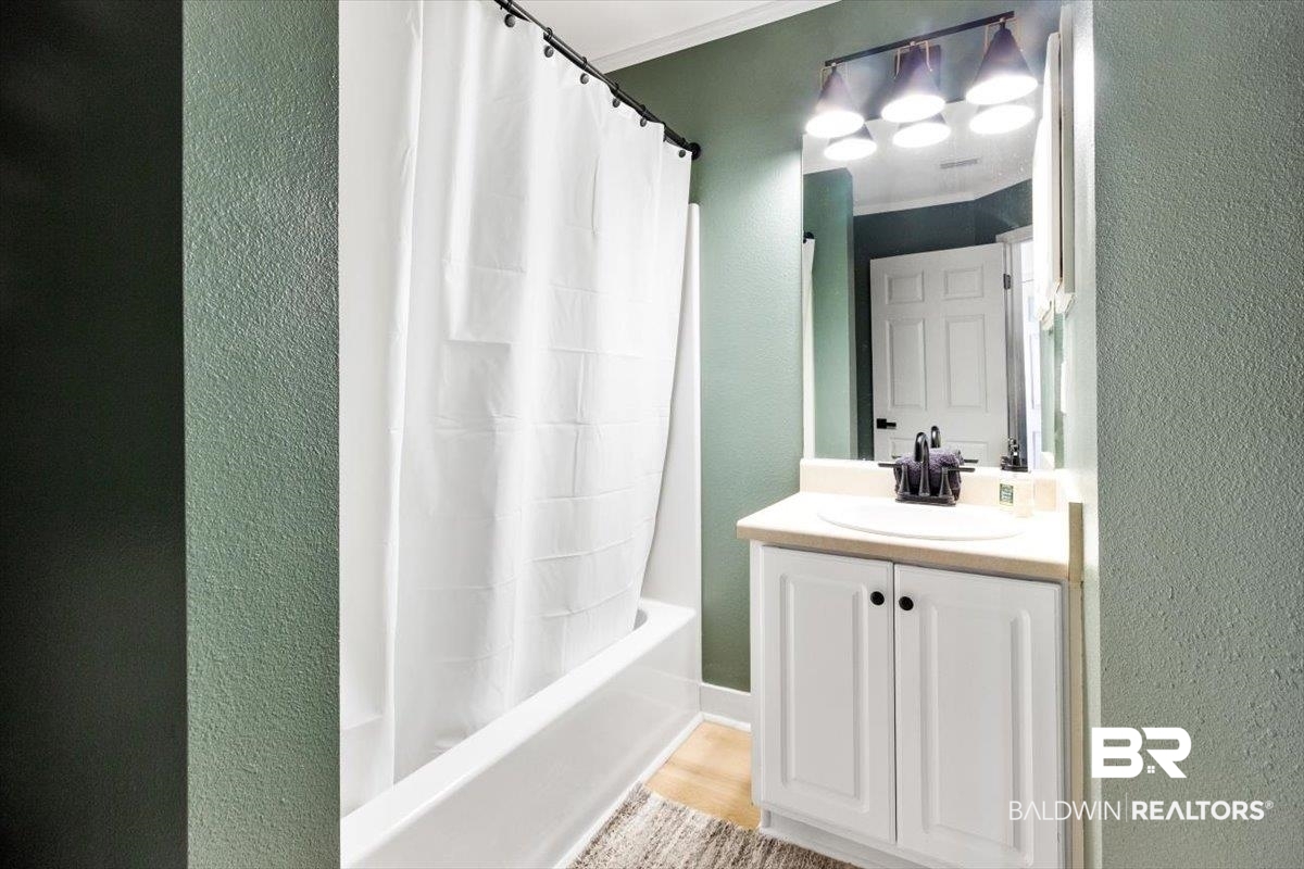 27809 Rileywood Drive Daphne, AL 36526 - Photo 26 of 38 Bathroom featuring vanity, shower / bath combo, and hardwood / wood-style floors
