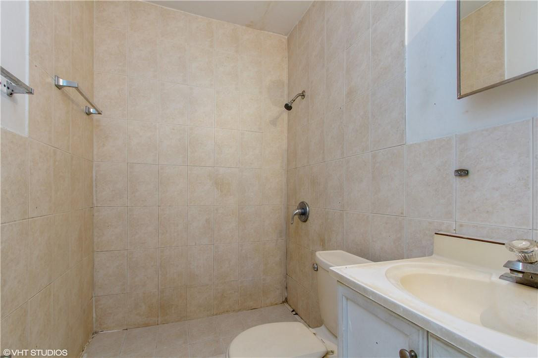 11398 Southwest 227th Terrace Miami, FL 33170 - Photo 11 of 13 a bathroom with a sink toilet and shower